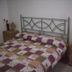 Casa Siciliana Altarbiah, Trabia: bedroom with double bed, patterned quilt, and bedside tables