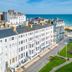 West Rocks Townhouse in Eastbourne with seafront view and white townhouse buildings near the beach
