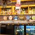 Nightcap at Sandringham Hotel bar with beer taps and backlit liquor display in Melbourne