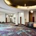 Renaissance Phoenix Glendale Hotel & Conference Center lobby in Glendale with curved front desk and patterned carpet