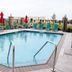 TownePlace Suites by Marriott Beaumont Port Arthur pool with loungers and umbrellas in Port Arthur