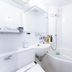 Apa Hotel Higashi Nihombashi Ekimae bathroom with compact tub, sink, mirror and shower in Tokyo