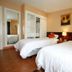Fontana Hot Spring Leisure Parks room in Angeles City with two twin beds and mirrored wardrobe