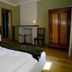 La Maison De Maitre in Arbrefontaine guest room with bed, sink, chair, and wardrobe