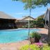 3 Liebeloft Guest House in Johannesburg with a small outdoor pool and thatched patio area