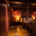Hotel Le Temps Fort, Tiruchirappalli: ornate four-poster bedroom with hanging bed swing and warm lighting