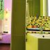 Ibis Styles Kuala Lumpur Fraser Business Park room with colorful wall art and a mosaic-tiled bathroom