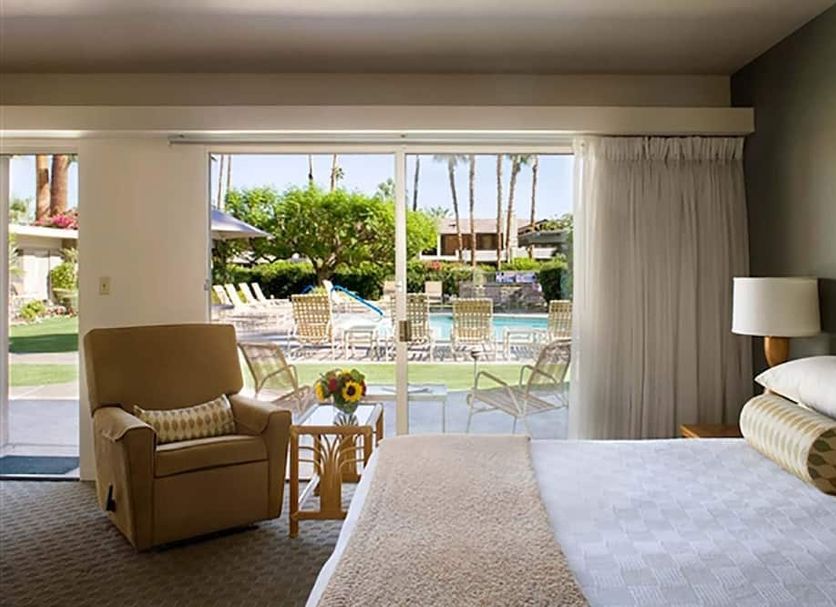 Desert Hills in Palm Springs guest room with patio access and pool view