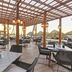 Hideaway at Royalton Punta Cana, Punta Cana: outdoor restaurant with thatched umbrellas and ocean view