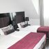 Fair Hotel Europaallee Frankfurt am Main guest room with two twin beds, desk, and wall-mounted TV