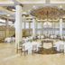 Grand banquet hall at NH Collection A Coruña Finisterre with chandeliers, tall columns and round tables