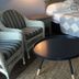 Summers Inn Ludington - Adults Only guest room with bed, striped chairs and round table in Ludington