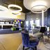 Novotel Basel City lobby with modern seating, circular pendant lights and reception area in Basel