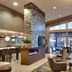 Residence Inn by Marriott Salt Lake City-West Jordan lobby with fireplace, lounge seating and tall windows