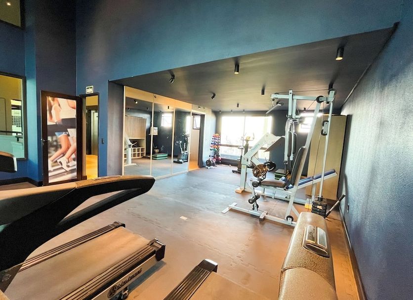 Swan Caxias do Sul gym with treadmill, weight machines and mirrors in Caxias do Sul