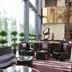 Haobo International Hotel in Wuxi lobby with tall windows, leather chairs, and modern seating