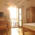 Cours Chabrol A Heritage Hotel By The Sea room with desk, bed and balcony door in Pondicherry