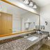 Best Western Gold Canyon Inn & Suites bathroom with granite vanity, large mirror and towel rack