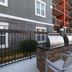 Homewood Suites by Hilton Atlanta - Alpharetta outdoor patio with grill and seating beside the building