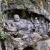 Tonight Inn in Hangzhou, stone Buddha carving in a rock grotto surrounded by greenery