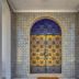 Hotel Borsalino in Porto features an ornate arched tiled doorway with patterned metal gates.