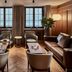 Grace La Margna St Moritz lounge with leather sofas, chairs and mountain-view windows in St. Moritz