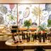 Hotel Bécquer in Seville breakfast buffet with fruit, bread, juice bottles and botanical wall art