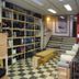 Hakuba Gondola Hotel in Hakuba lobby with ski gear shelves, checkered floor and stairs
