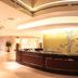 Century Palace Hotel Huiyang lobby in Huizhou with marble floors, columns and a central seating area