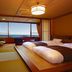 Houraiya, Kamogawa guest room with tatami floor, twin beds, and ocean view