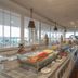 Nims Hotel Seminyak buffet dining area in Kuta with ocean views and indoor seating