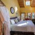 Elliott House Boutique Inn, Shaver Lake: cozy room with king bed, fireplace, and wooded balcony view