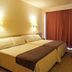 htop Molinos Park in Salou guest room with twin beds, wall lamps and red curtains