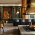 Renaissance Boulder Flatiron Hotel in Broomfield lounge with dining table, fireplace, and bar seating