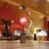 Village Cabo Girao in Câmara de Lobos dining room with wood-beamed ceiling and red walls