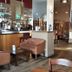 Winchelsea Lodge bar and lounge in Winchelsea with leather armchairs, wooden tables and staircase