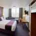 Premier Inn Birmingham - Great Barr/M6 J7 room with double bed, sofa, desk and wall-mounted TV