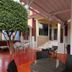 Hotel Santa Maria in Praia: shaded patio with tables, chairs, and entrance steps