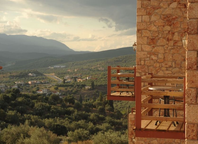 Melies Hotel in Kokkinorrachi with stone terrace overlooking a valley and mountains