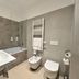 Riva del Sole bathroom in Giovinazzo with bathtub, wall-mounted sink, bidet and heated towel rail