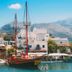 La Maison Ottomane in Chania with waterfront sailboats and mountain views