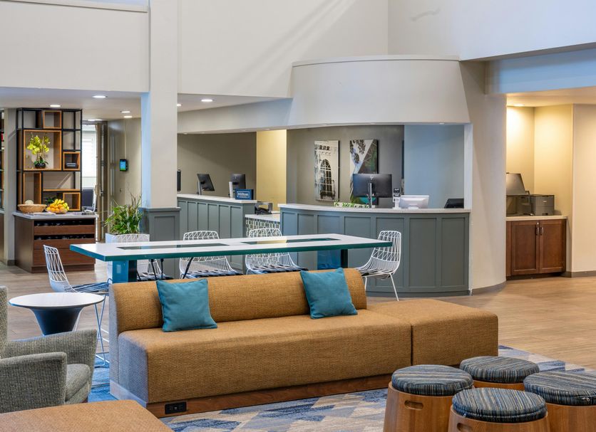 DoubleTree by Hilton Hotel Campbell - Pruneyard Plaza lobby with seating area and front desk in Campbell