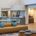 DoubleTree by Hilton Hotel Campbell - Pruneyard Plaza lobby with seating area and front desk in Campbell