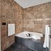 Somerset Bed & Breakfast Niagara-on-the-Lake bathroom with tiled walls and a soaking tub