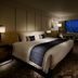 Grand Prince Hotel Takanawa in Tokyo guest room with king bed and city skyline view at night