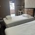 The Quay Hotel Bugis Singapore room with two single beds and a small desk by the window