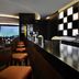 Mövenpick Hotel Jumeirah Beach Dubai bar seating with long counter and modern lounge interior