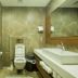 Accra Fine Suites bathroom in Accra with shower-tub, toilet, and modern vanity sink
