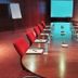 Westgrove Hotel in Kildare meeting room with long conference table, red chairs, projector screen and flip chart