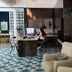 Hôtel Saint-Clair, côté Plage in La Grande-Motte: modern lobby with reception desk and patterned blue carpet
